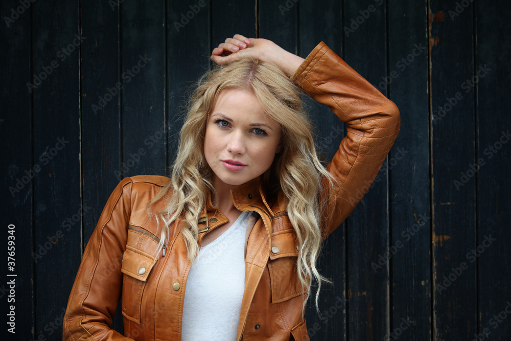 Portrait of beautiful blond woman with leather jacket Portrait of beautiful blond woman with leather jacket