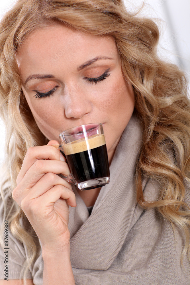 Portrait of blond woman drinking expresso Portrait of blond woman drinking expresso