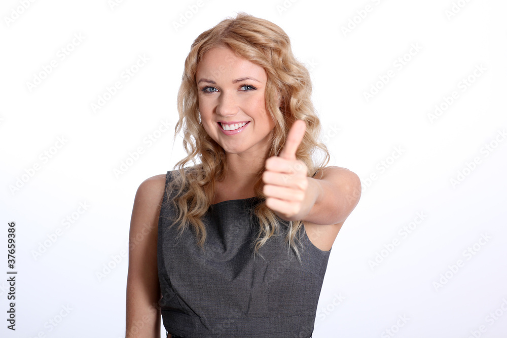 Portrait of businesswoman showing thumb up