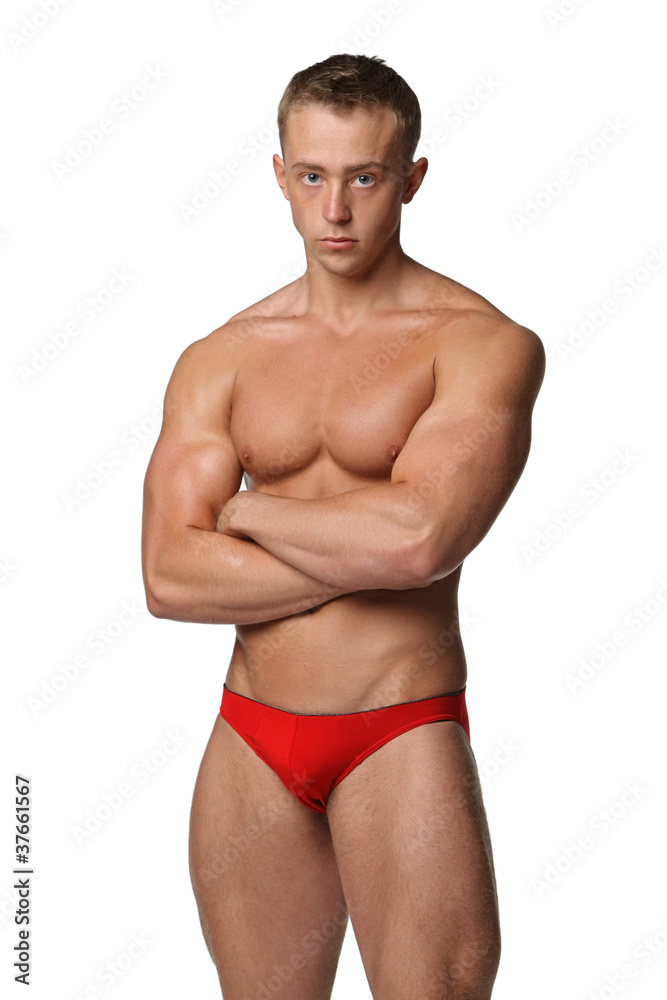 Muscle sexy young man posing in studio Muscle sexy young man posing in studio