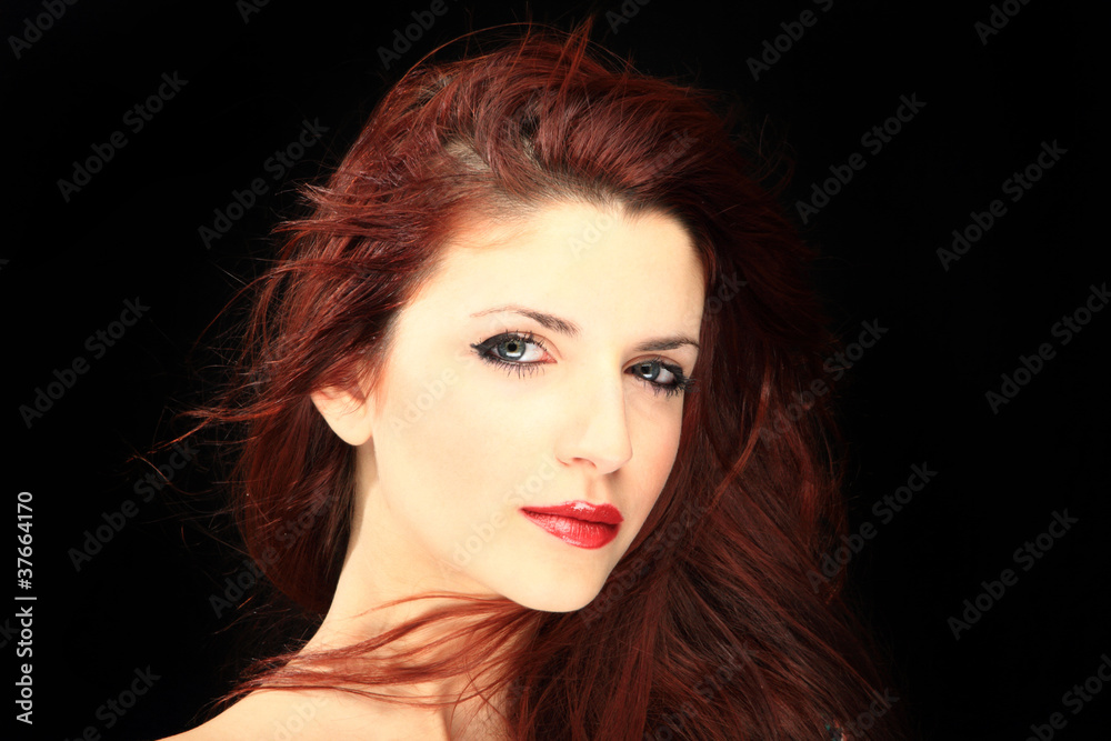 Fototapeta premium Glamour portrait of a woman on black