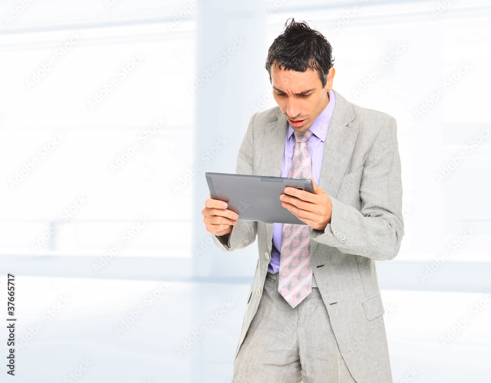 Businessman standing in hall Businessman standing in hall