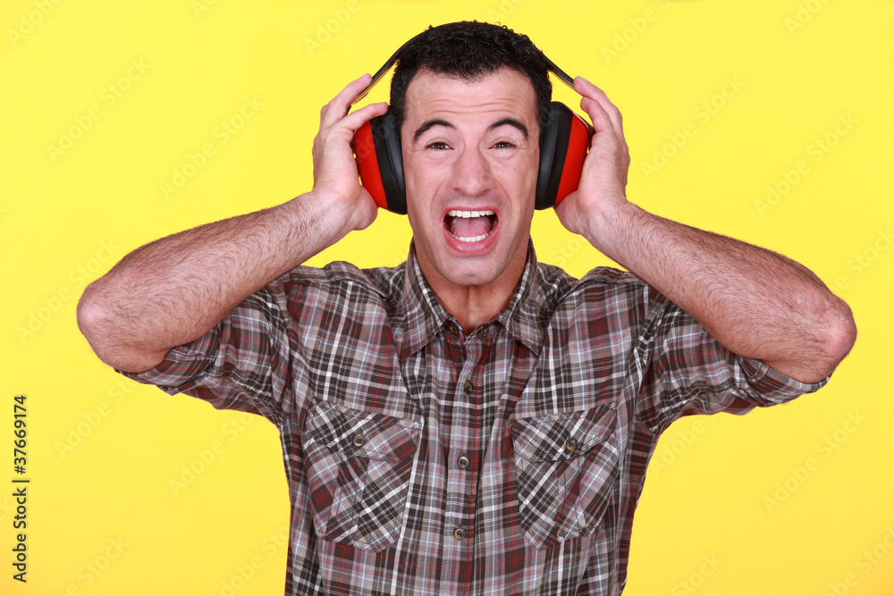 Builder wearing hearing protection Builder wearing hearing protection