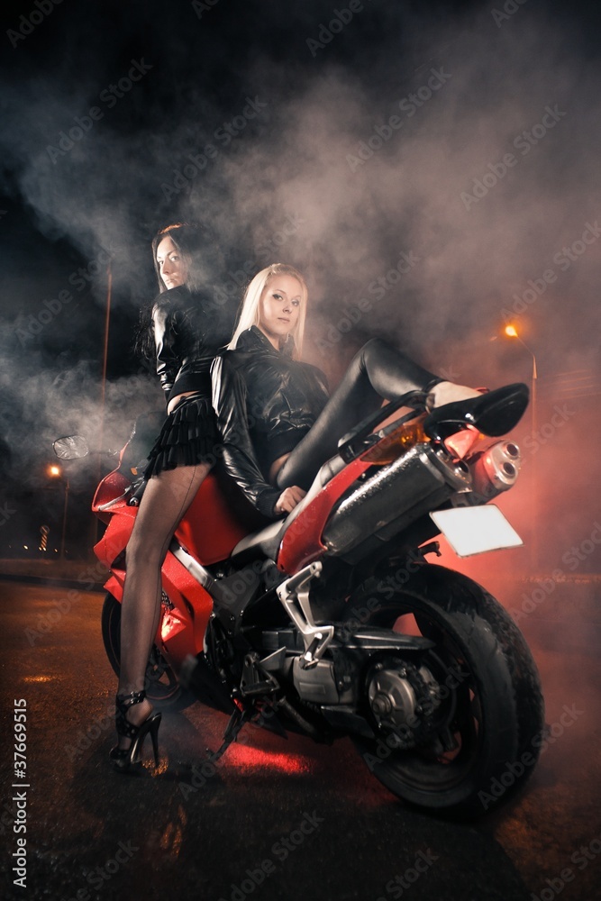 Young attractive women and motorcycle