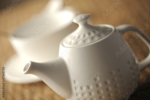 Quadro em tela teapot on table, close up, shallow dof