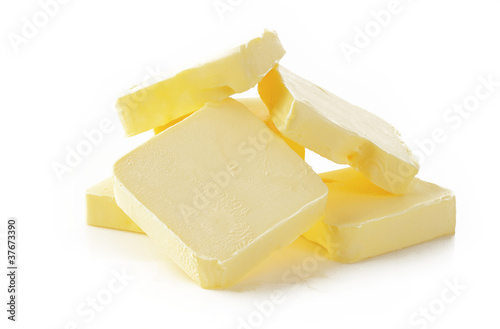 Piece of butter  on  white background