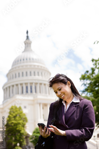 Asian business woman with smartphone on Capitol Hill