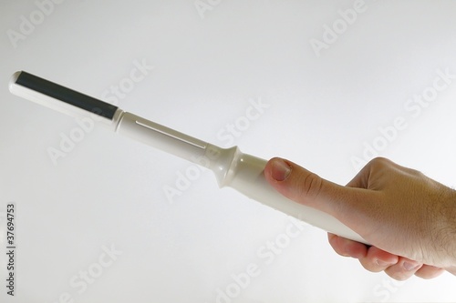 Rectal linear ultrasound probe for urology held in right hand photo