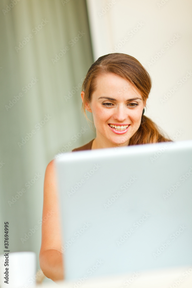 Portrait of beautiful woman working on laptop Portrait of beautiful woman working on laptop