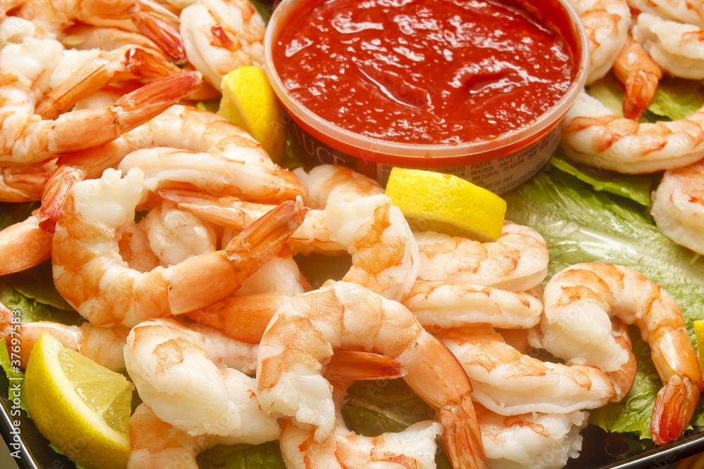 Jumbo Cooked Shrimp with Cocktail Sauce and Lemon Wedges Jumbo Cooked Shrimp with Cocktail Sauce and Lemon Wedges