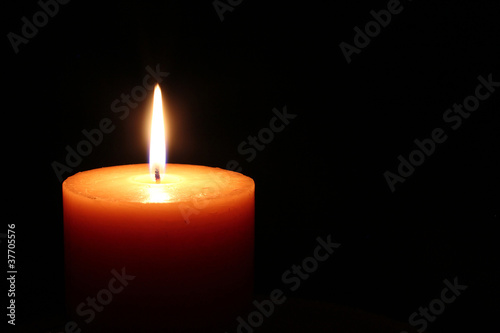 Candle on a black background