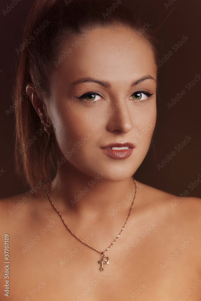 Young brunette lady posing on grey background