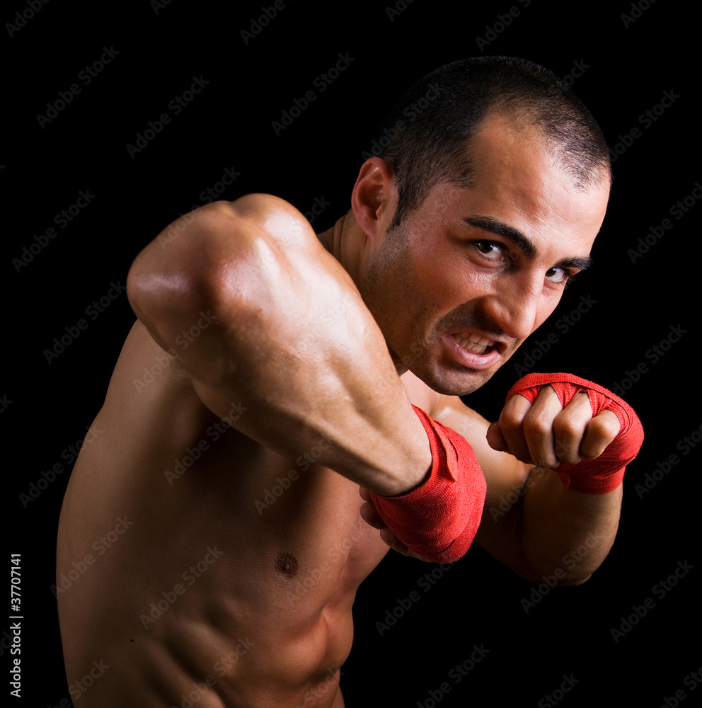 Young Boxer fighter over over black background Young Boxer fighter over over black background