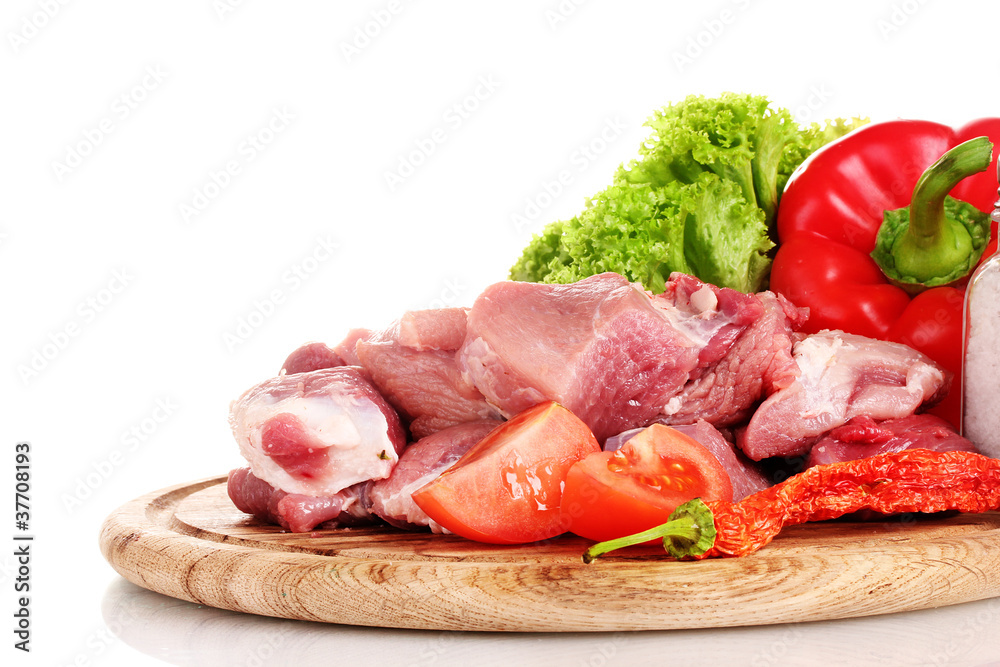 Pieces of raw meat and vegetables Pieces of raw meat and vegetables