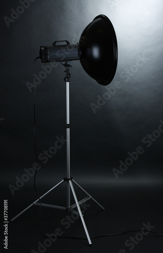 Studio flash with beauty dish on grey background