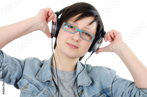 Girl listens to music through ear-phones