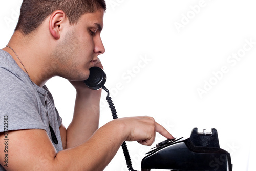 Man Dialing Old Rotary Telephone