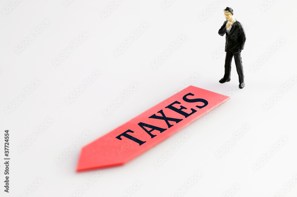 Taxes direction and toy business man Taxes direction and toy business man