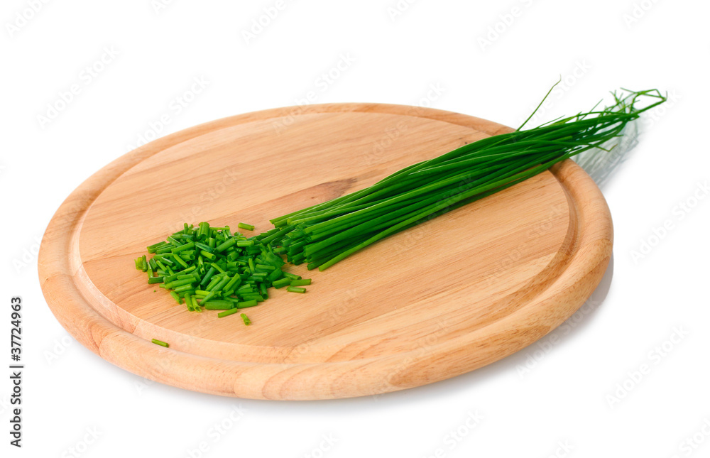 beautiful green onion chives on wooden board isolated on white beautiful green onion chives on wooden board isolated on white