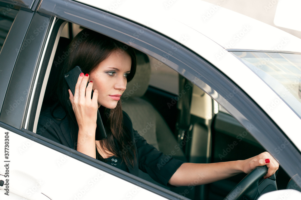 woman in car calling by phone