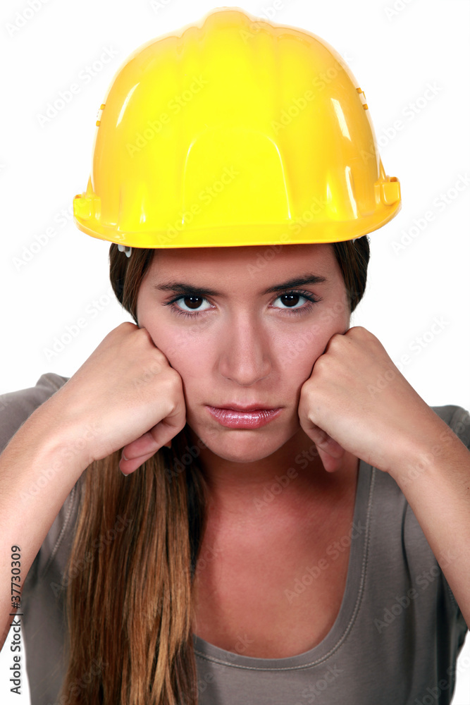 An angry female construction worker.
