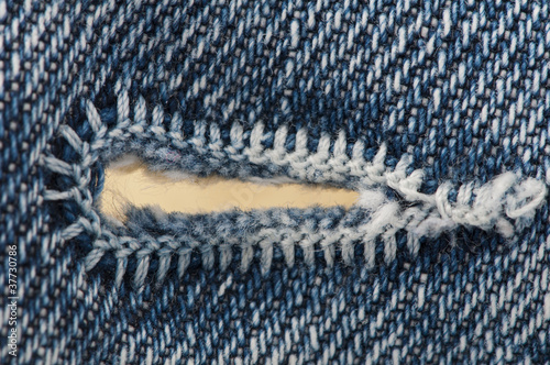 Buttonhole of jeans cloth photo