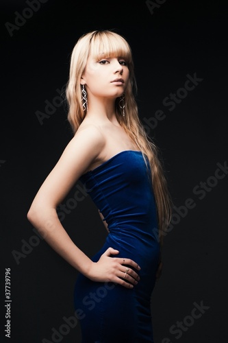 beautiful young girl over black background