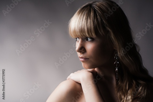 beautiful young girl over gray background