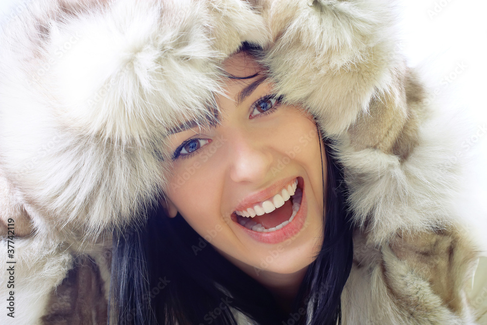 close-up of beautiful smiling young woman in fur close-up of beautiful smiling young woman in fur