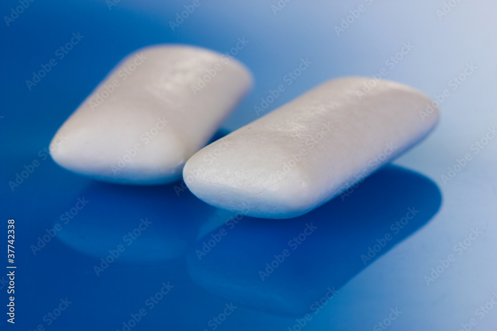 Chewing gums on blue background