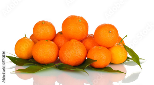 Ripe tasty tangerines with leaves isolated on white