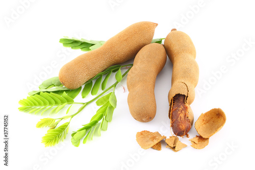 Tamarind cracked on green leaf.