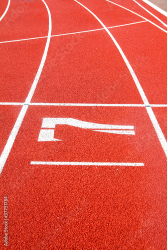 Number 7 on the start of a running track