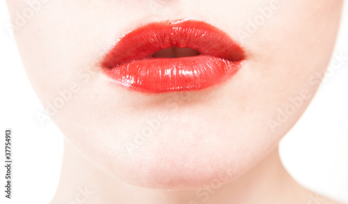 closeup of beautiful red lips on white background