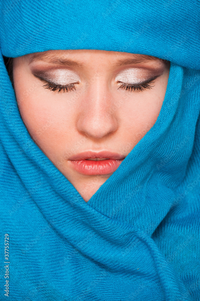 Fototapeta premium young beautiful girl with closed eyes in blue scarf