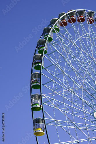 Large Ferris wheel in blue sky background