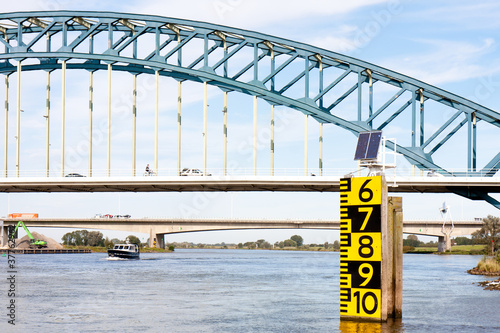 Measurement of the freeboard of a big bridge in the Dutch over t photo