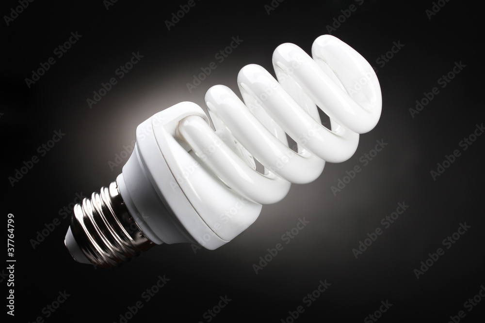 Energy saving lamp on black background Energy saving lamp on black background