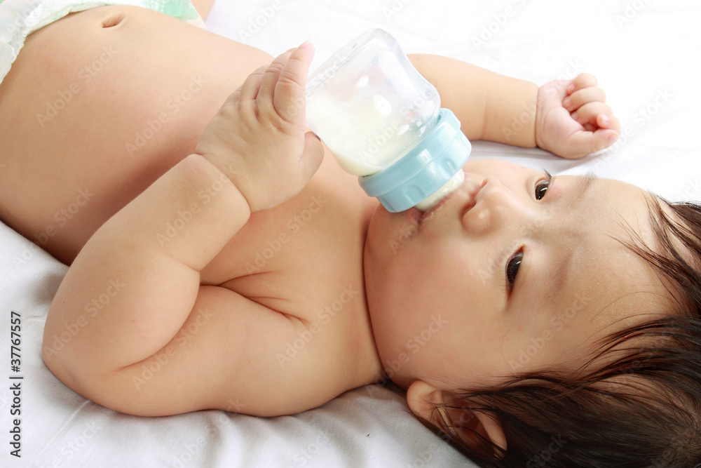 little boy drinks milk