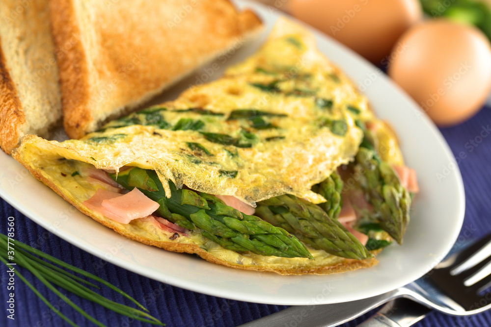 Green asparagus and ham omelet with toast bread