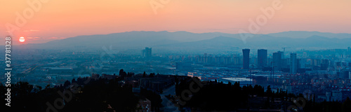 Sunset over Barcelona with Skyscrappers Silhouettes,