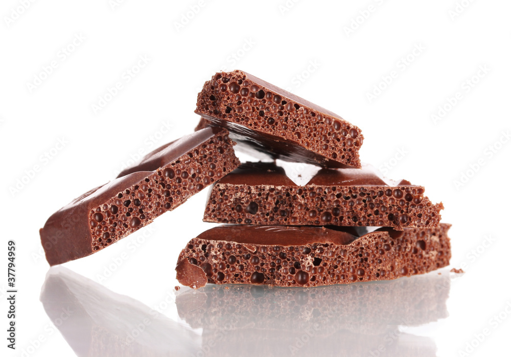 Slices of milk chocolate bar isolated on white Slices of milk chocolate bar isolated on white