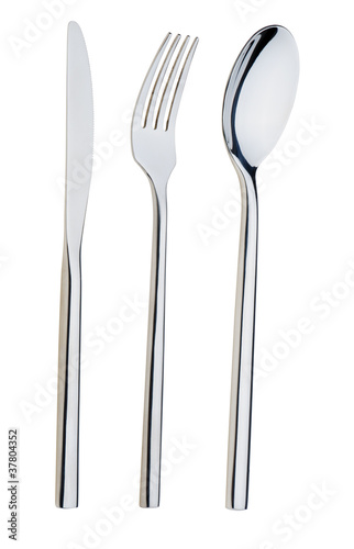 Spoon, fork and a knife lie on a plate