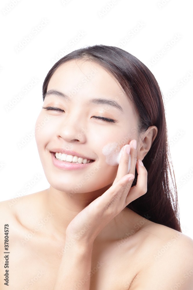 Beautiful woman washing her beauty face with cleansing foam Beautiful woman washing her beauty face with cleansing foam