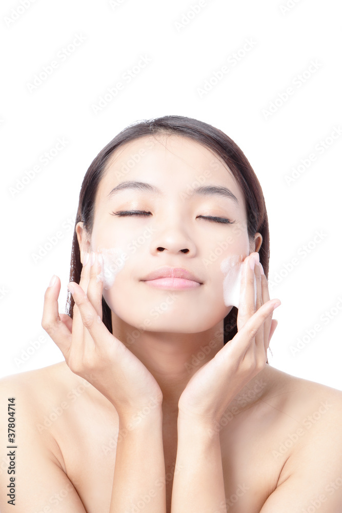 Beautiful woman washing her beauty face with cleansing foam Beautiful woman washing her beauty face with cleansing foam