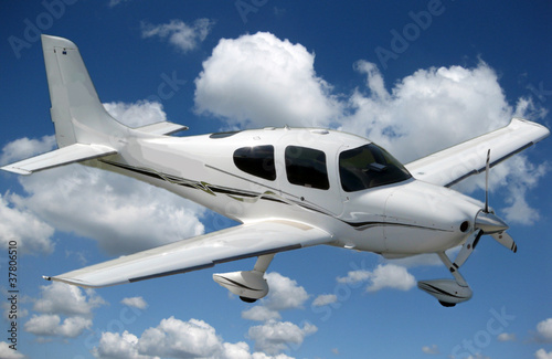 small prop plane cruising in sky