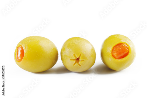 three green olives on white background