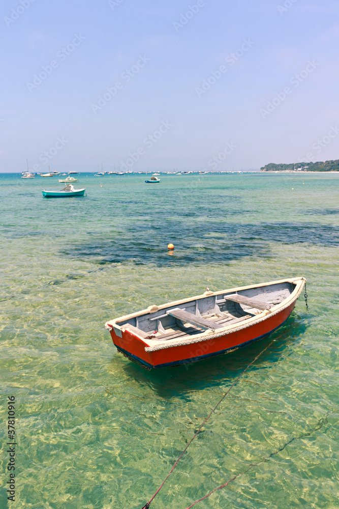 Wooden boat in shallow water