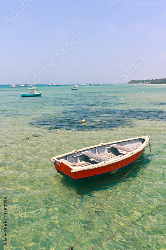 Wooden boat in shallow water