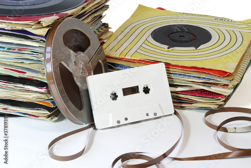 Vintage Records with Tape Reel and Cassette.